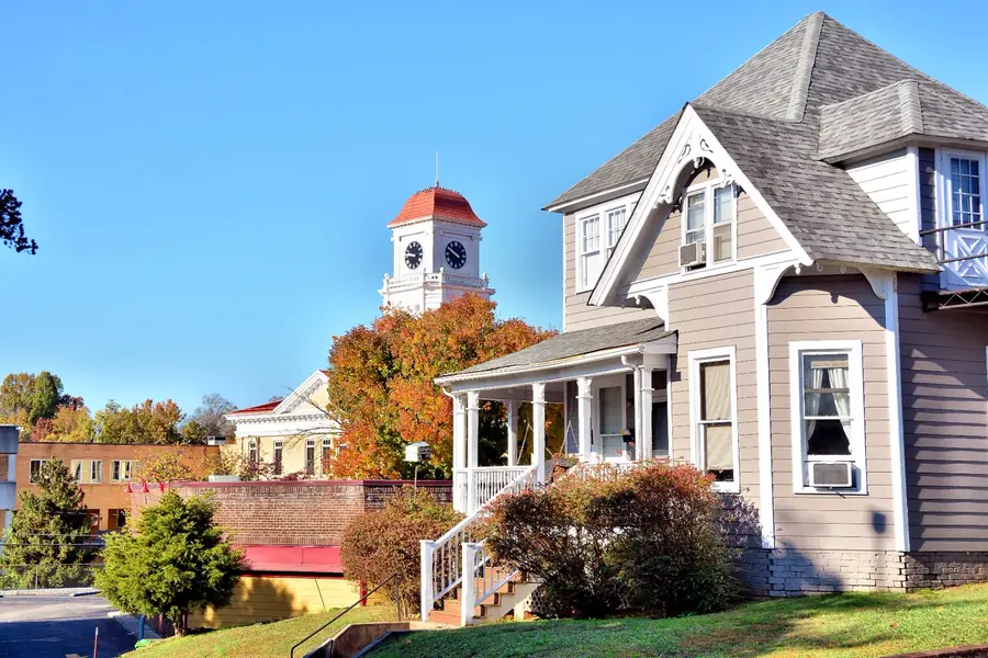 Repainted two-story home with fresh siding and white trim near downtown Maryville, Tennessee